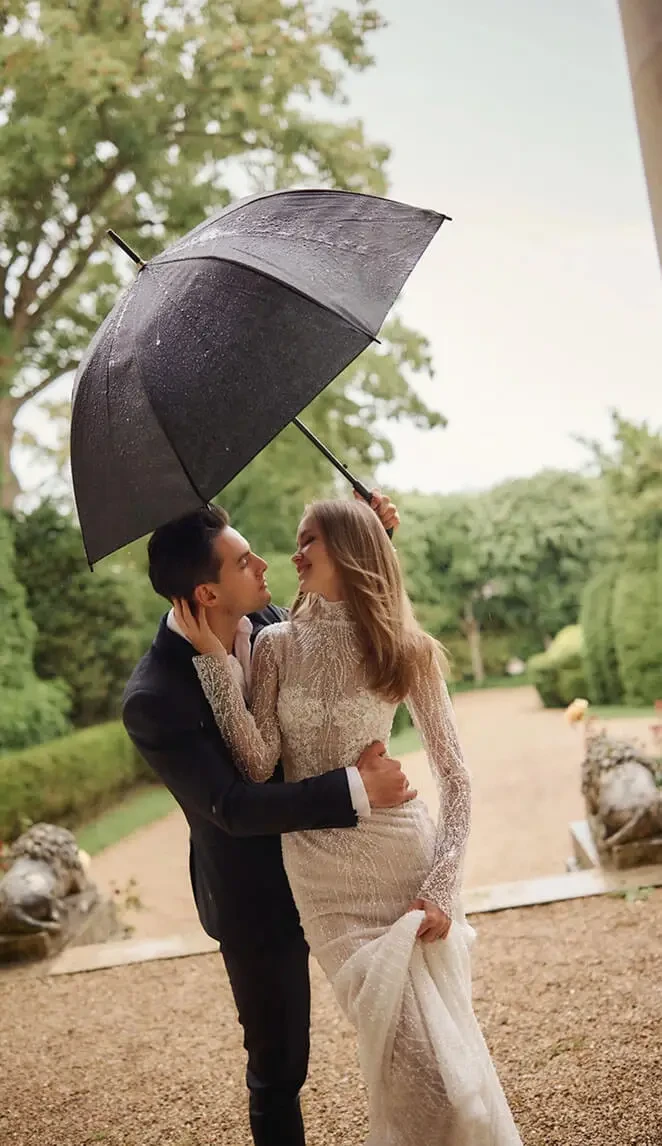 Сouple wearing a white gown and a black suit
