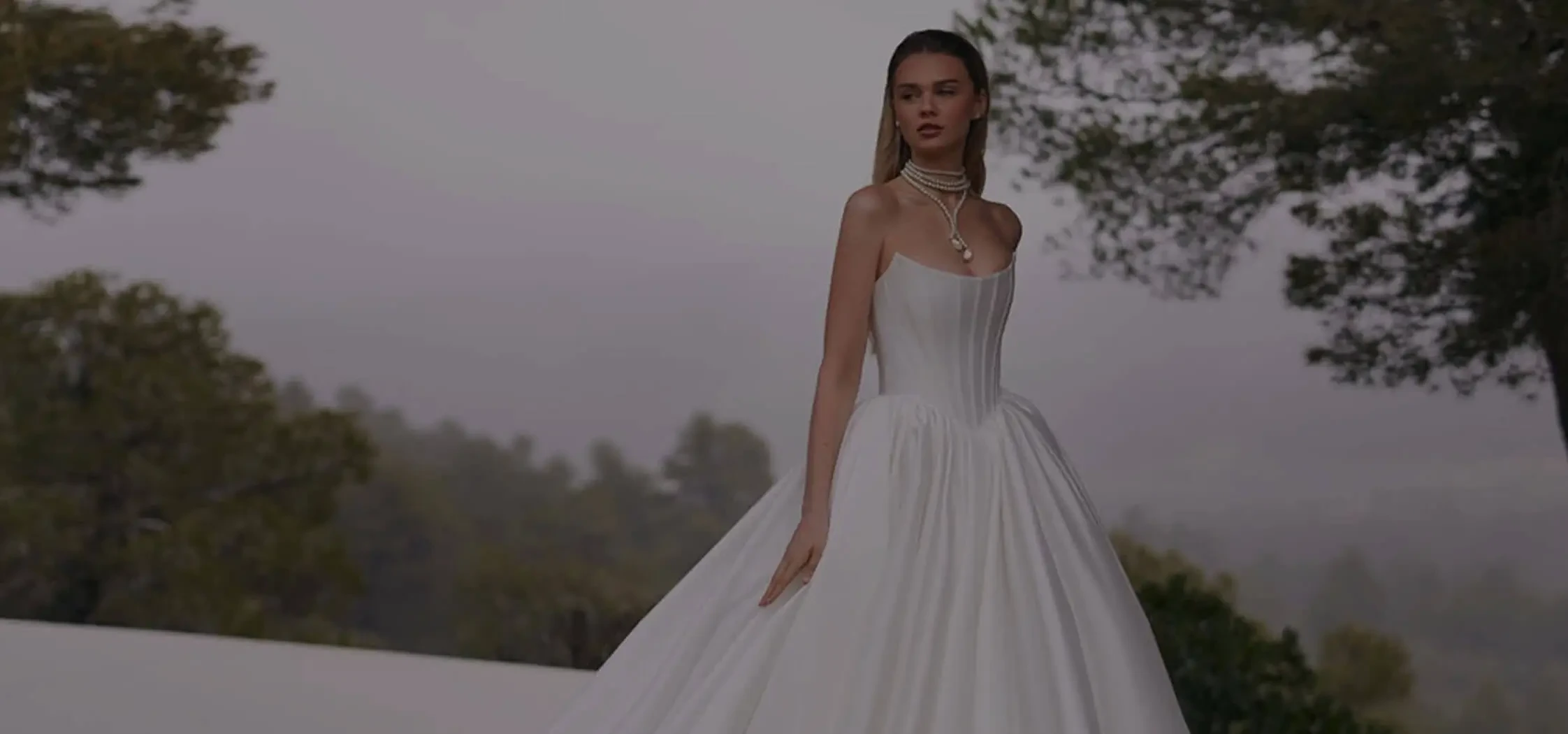 Model wearing a white dress