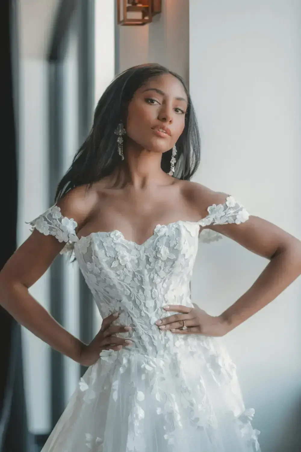 Сouple wearing a white gown and a black suit