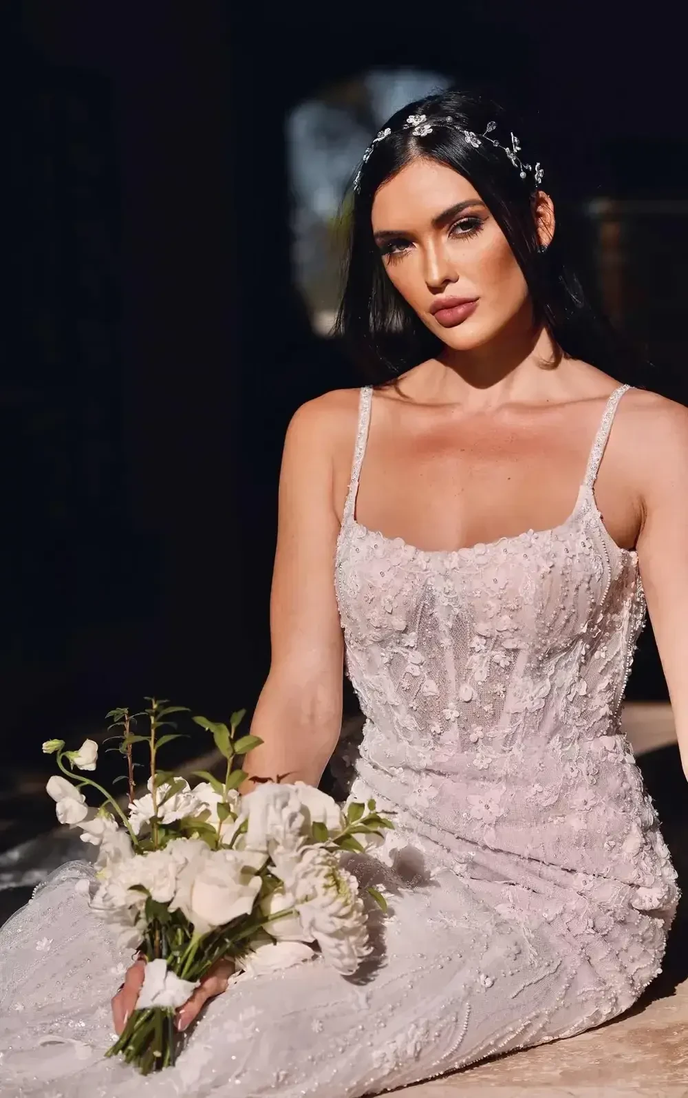 Model wearing a white gown