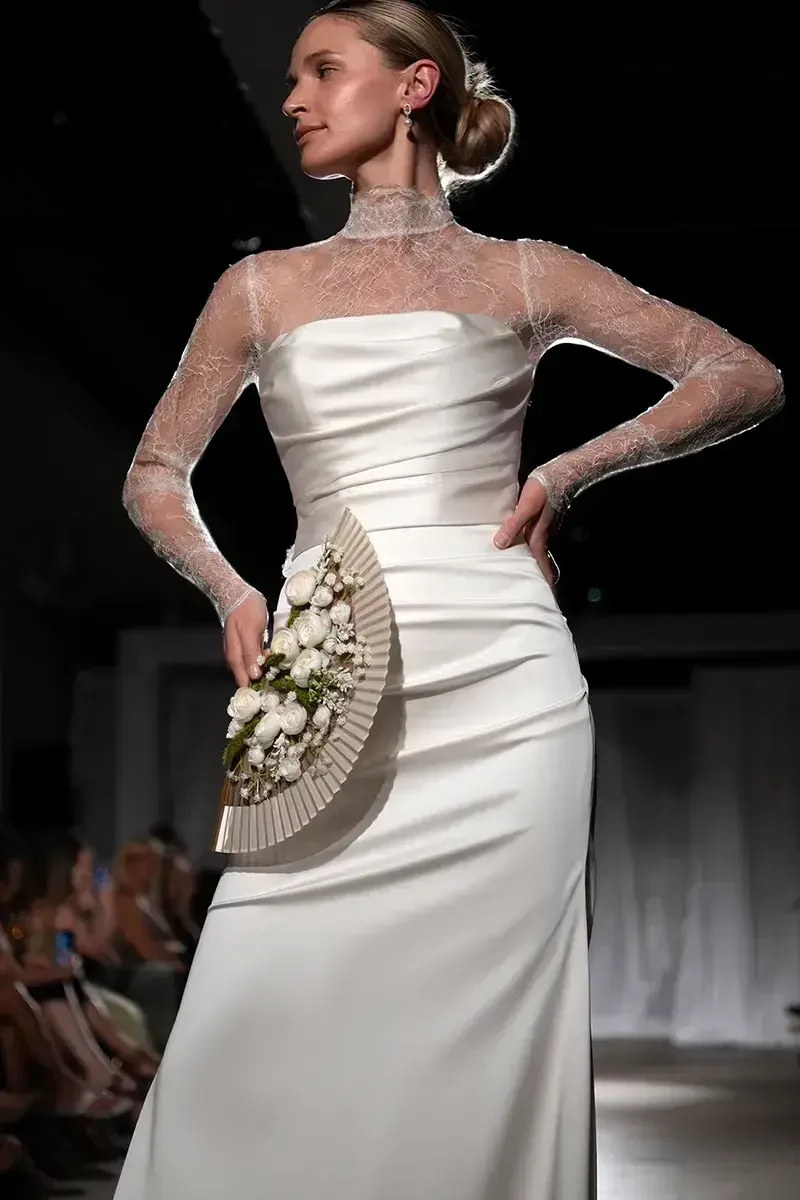 Сouple wearing a white gown and a black suit